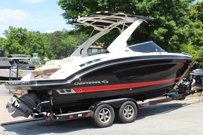 Slide: The Image of 2016 Chaparral 257 SSX boat parked on trailer outdoors. - 7