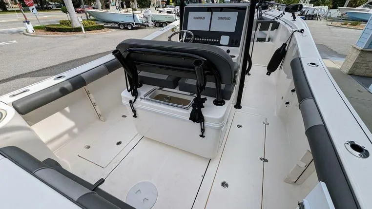 Slide: The Image of 2023 Sea Born SX239 Offshore boat interior with seating and control console. - 13