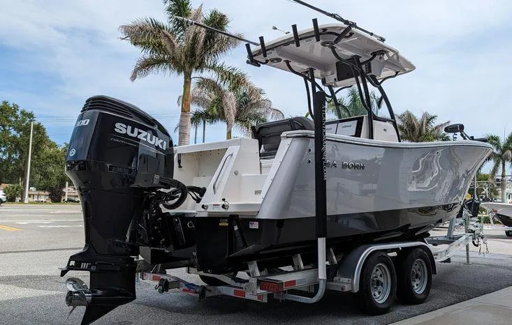 Slide: The Image of 2023 Sea Born SX239 Offshore boat on trailer with Suzuki outboard motor. - 3