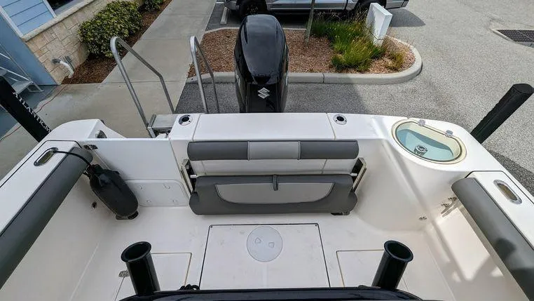 Slide: The Image of 2023 Sea Born SX239 Offshore boat stern with seating and Suzuki outboard motor. - 5