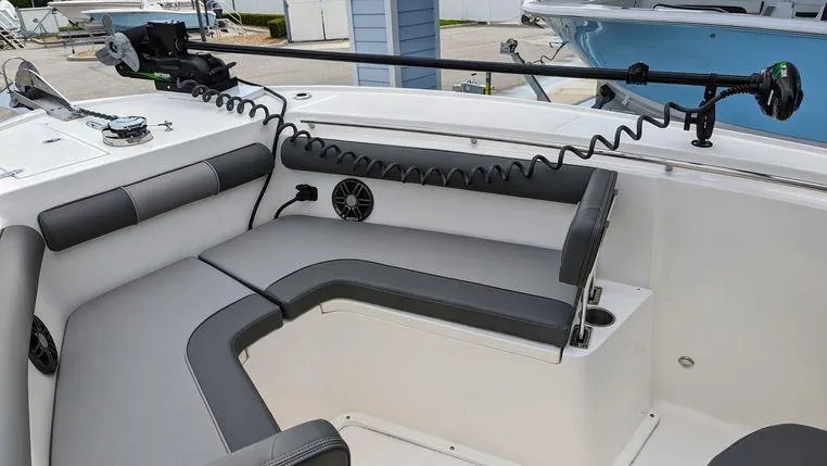 Slide: The Image of 2023 Sea Born SX239 Offshore boat interior with seating and fishing equipment. - 6