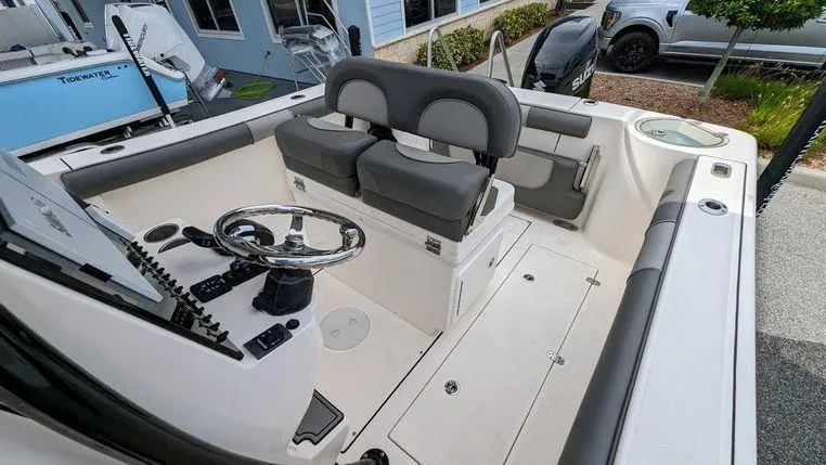 Slide: The Image of 2023 Sea Born SX239 Offshore boat interior with dual seats and steering console. - 9