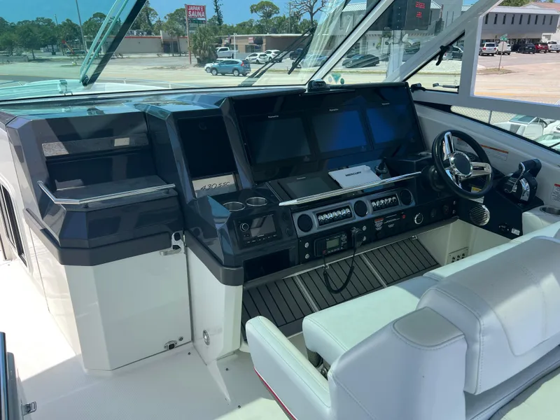 Slide: The Image of 2017 Formula 430 Super Sport Crossover interior with white seating and a central table. - 14