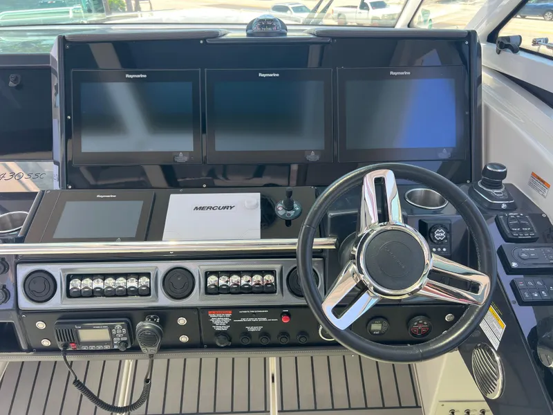 Slide: The Image of 2017 Formula 430 Super Sport Crossover boat interior with seating and kitchenette. - 15