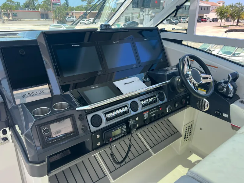 Slide: The Image of 2017 Formula 430 Super Sport Crossover cockpit with modern navigation and control systems. - 16