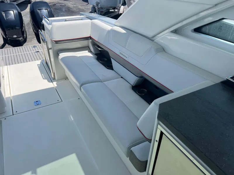 Slide: The Image of 2017 Formula 430 Super Sport Crossover boat interior with seating and table. - 25