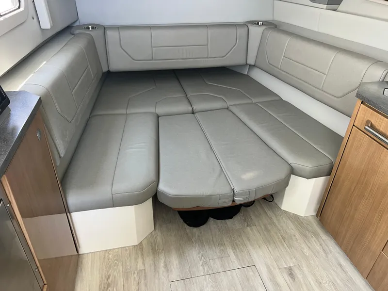 Slide: The Image of Interior of 2017 Formula 430 Super Sport Crossover boat, featuring seating and cabinetry. - 28