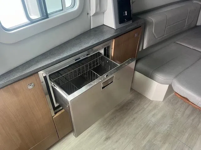 Slide: The Image of 2017 Formula 430 Super Sport Crossover interior with modern kitchenette and seating area. - 31