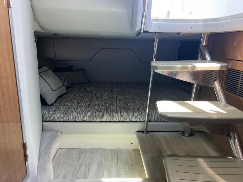 Slide: The Image of 2017 Formula 430 Super Sport Crossover bathroom with modern fixtures and wood accents. - 34