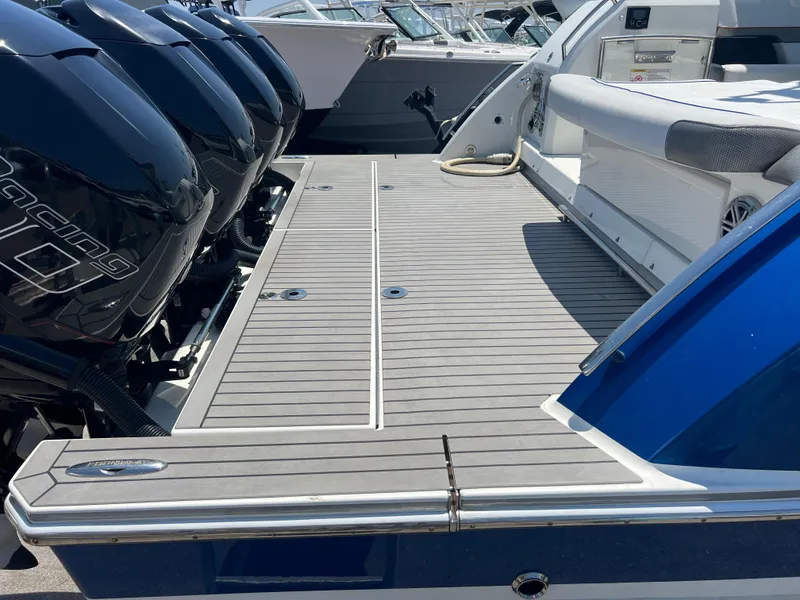 Slide: The Image of 2017 Formula 430 Super Sport Crossover boat with multiple outboard engines and spacious deck. - 39