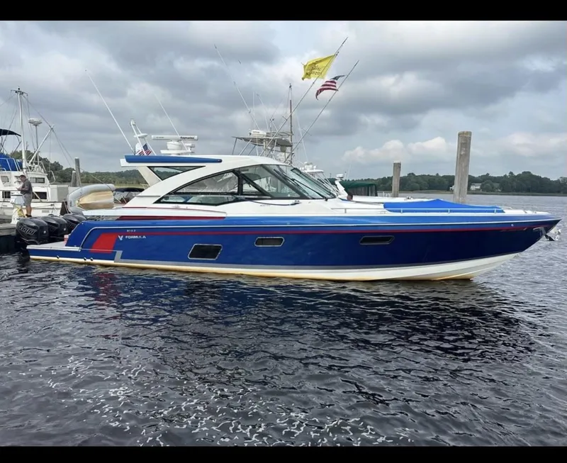 Slide: The Image of 2017 Formula 430 Super Sport Crossover boat with four powerful outboard engines on a trailer. - 7