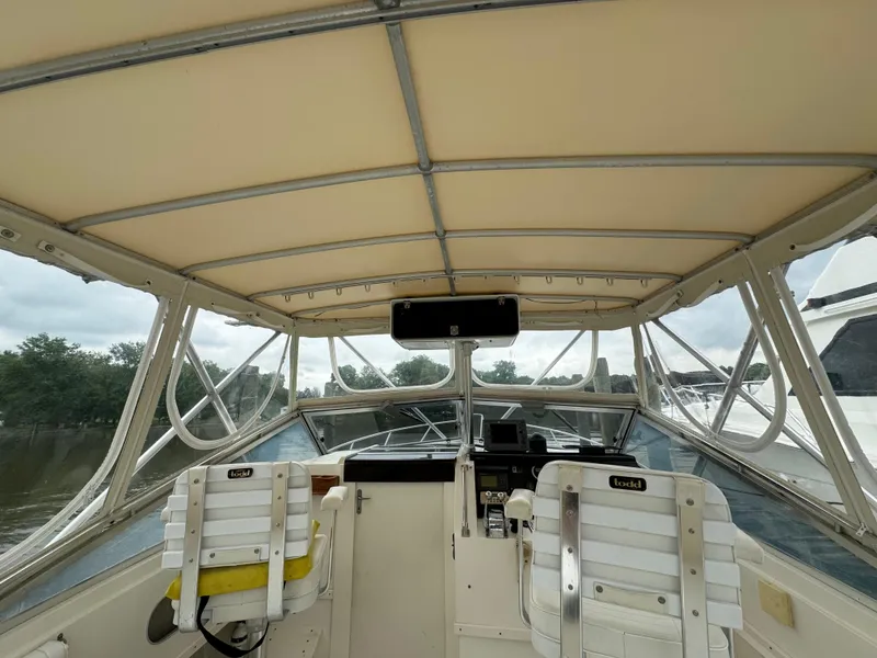 Slide: The Image of 1992 Blackfin 29 Express boat interior with helm and seating. - 11