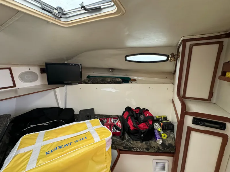 Slide: The Image of Interior cabin of a 1992 Blackfin 29 Express boat with storage and equipment. - 17