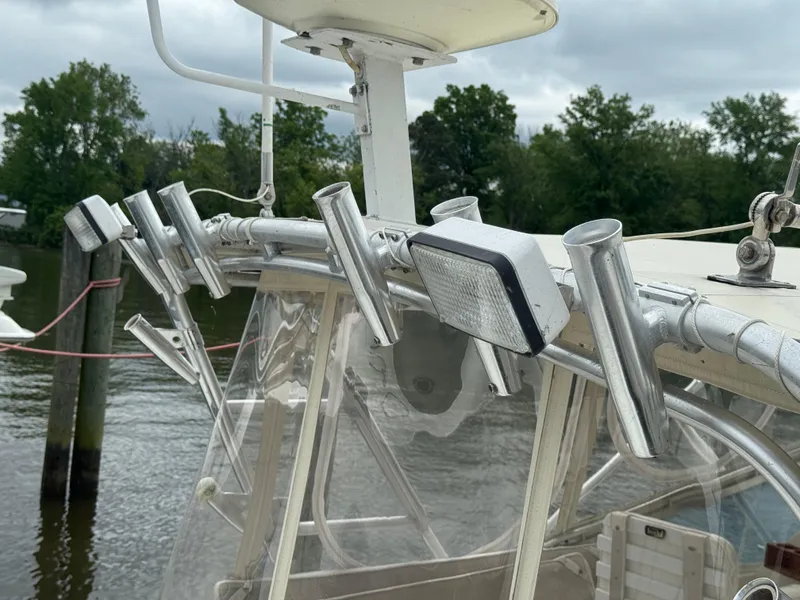 Slide: The Image of 1992 Blackfin 29 Express boat with rod holders and light on the deck. - 6