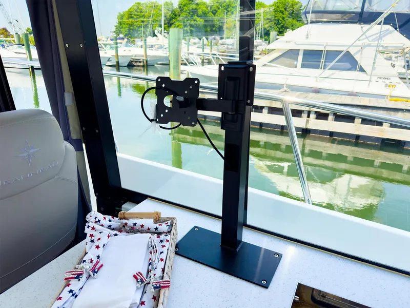 Slide: The Image of Interior view of 2021 Jeanneau NC 1095 FLY with marina background. - 15