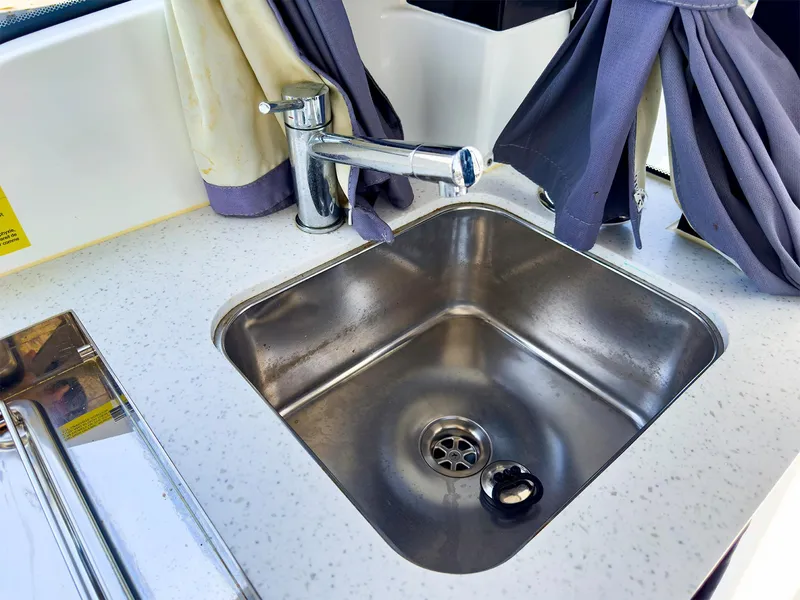 Slide: The Image of Stainless steel sink in Jeanneau NC 1095 FLY 2021 boat kitchen. - 17