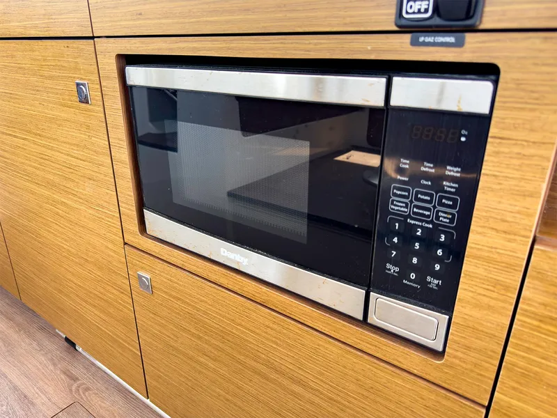 Slide: The Image of Built-in microwave in 2021 Jeanneau NC 1095 FLY yacht kitchen. - 18