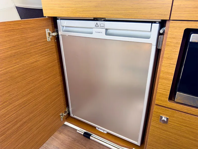 Slide: The Image of Built-in refrigerator on the 2021 Jeanneau NC 1095 FLY boat. - 19