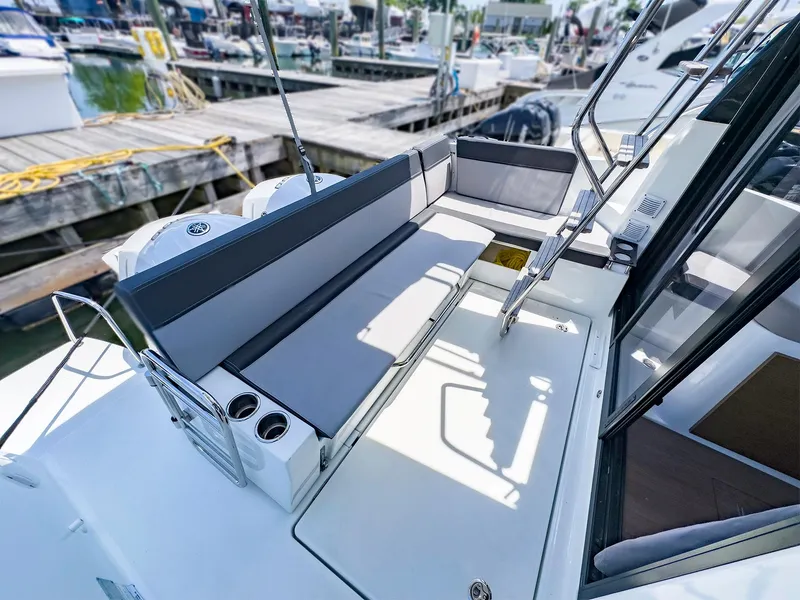 Slide: The Image of 2021 Jeanneau NC 1095 FLY boat with spacious seating area at the dock. - 20