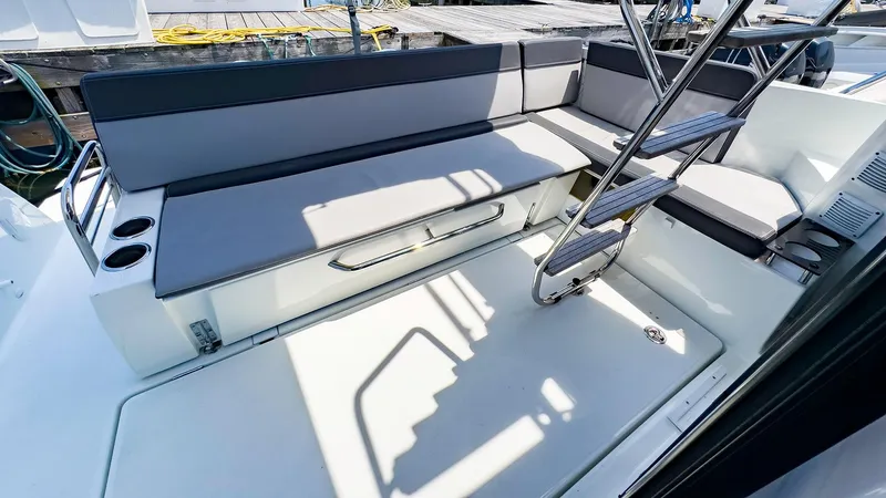 Slide: The Image of 2021 Jeanneau NC 1095 FLY boat interior with seating and ladder. - 21