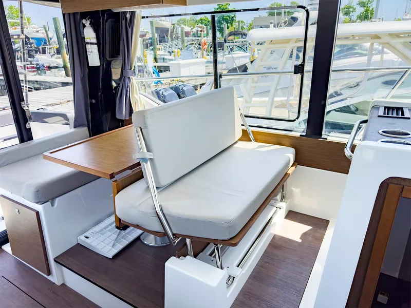 Slide: The Image of Interior of 2021 Jeanneau NC 1095 FLY boat with seating and table. - 23