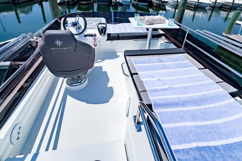 Slide: The Image of 2021 Jeanneau NC 1095 FLY boat deck with seating and helm station. - 29