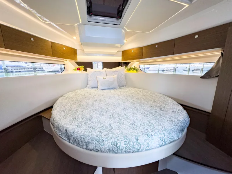 Slide: The Image of Luxurious bedroom interior of 2021 Jeanneau NC 1095 FLY yacht with round bed. - 33