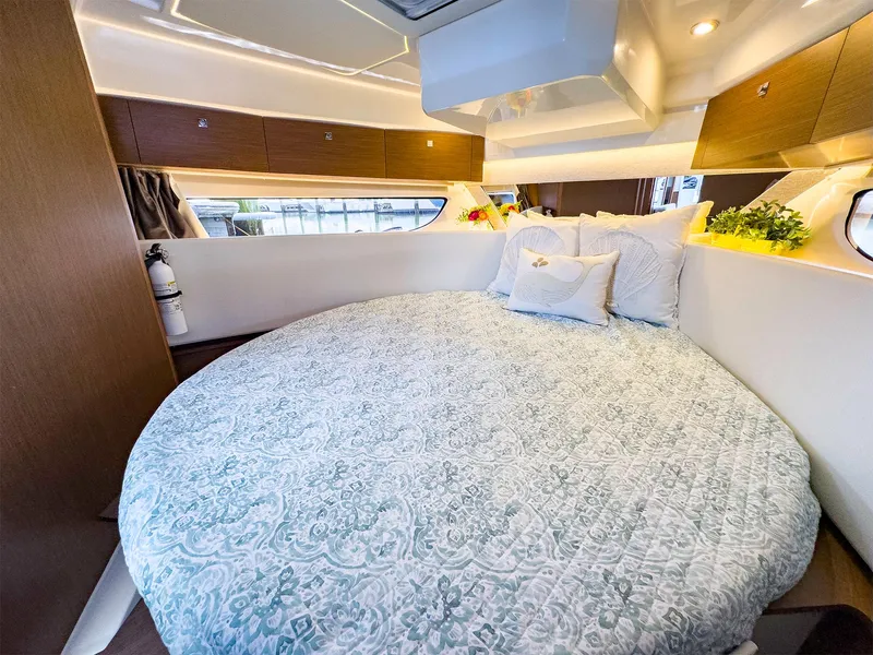 Slide: The Image of Luxurious bedroom in 2021 Jeanneau NC 1095 FLY yacht with round bed and elegant decor. - 34