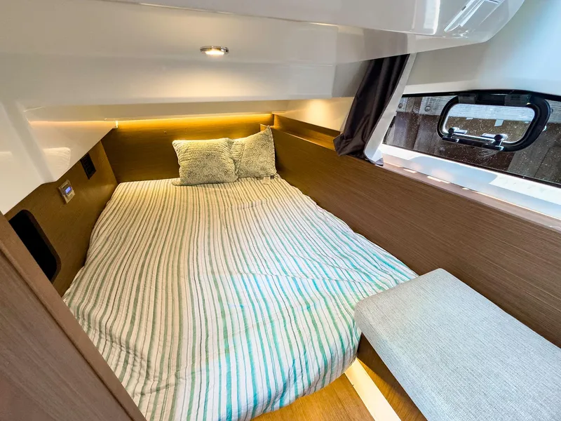 Slide: The Image of 2021 Jeanneau NC 1095 FLY cabin with cozy bed and modern interior design. - 36