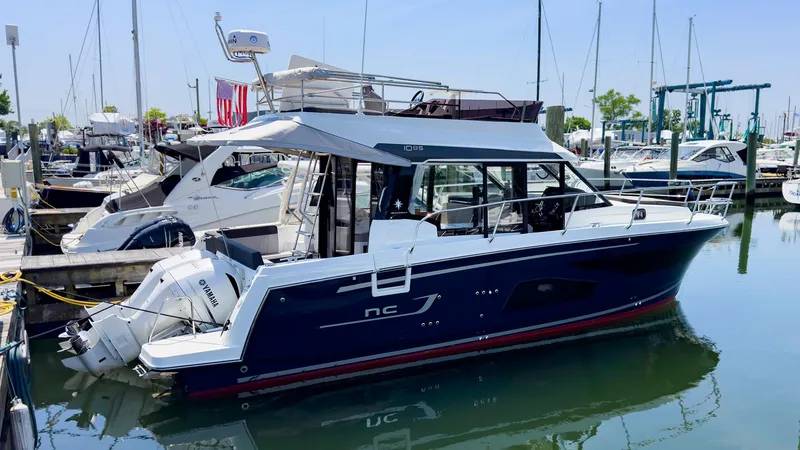 Slide: The Image of 2021 Jeanneau NC 1095 FLY motor yacht docked in a marina. - 39