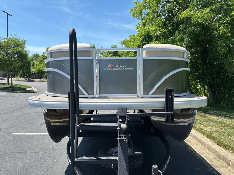 Slide: The Image of 2024 Sun Tracker Party Barge 20 DLX pontoon boat on trailer. - 4