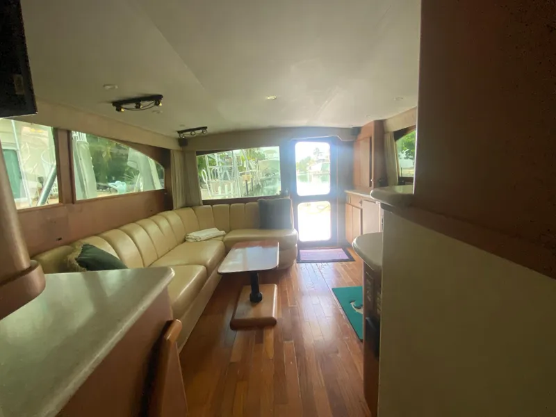 Slide: The Image of Interior of 2001 Egg Harbor 37 Convertible yacht with leather seating and wooden flooring. - 14