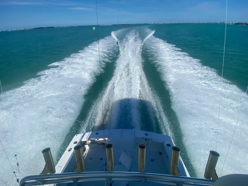 Slide: The Image of Egg Harbor 37 Convertible 2001 cruising on open water, leaving a wake trail. - 3