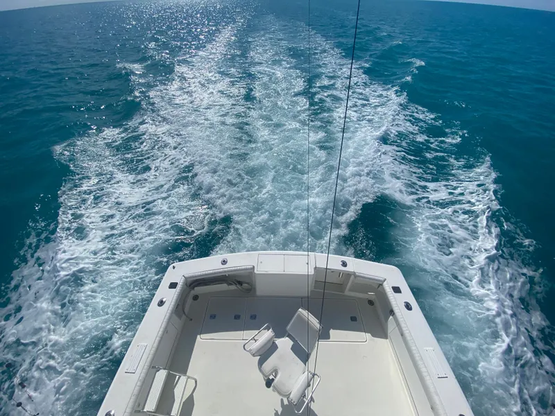 Slide: The Image of Egg Harbor 37 Convertible 2001 cruising on open water, view from stern. - 4