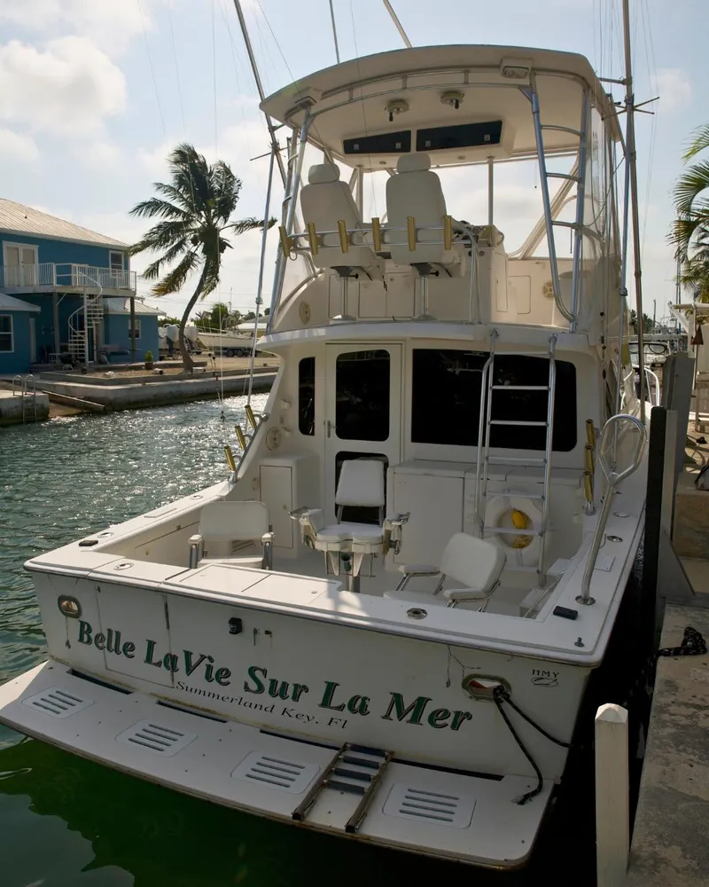 Slide: The Image of 2001 Egg Harbor 37 Convertible yacht docked at a marina. - 5