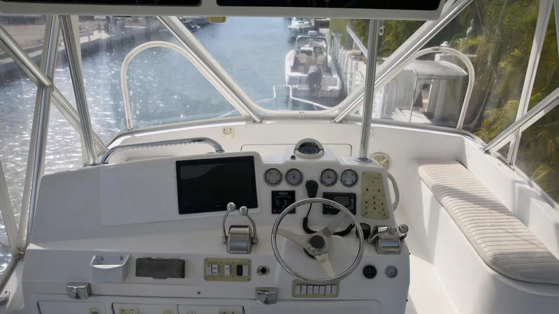 Slide: The Image of Cockpit view of a 2001 Egg Harbor 37 Convertible yacht with navigational instruments. - 6