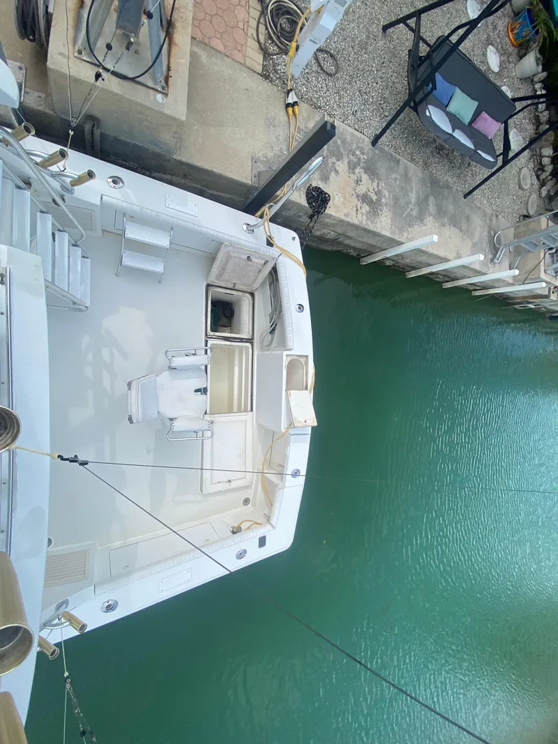 Slide: The Image of Top view of a 2001 Egg Harbor 37 Convertible docked at a marina. - 8
