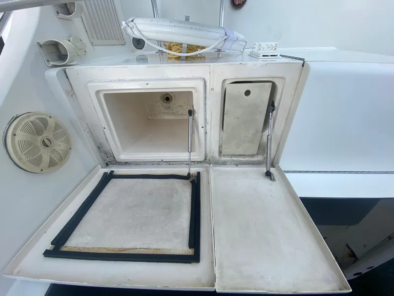 Slide: The Image of Open storage compartments on a 2001 Egg Harbor 37 Convertible boat. - 9