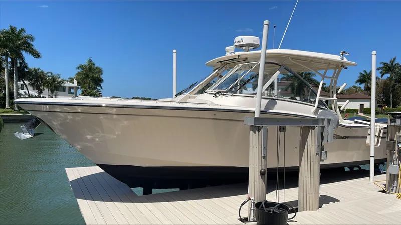 The Image of 2018 Grady-White Freedom 335 boat docked in a sunny marina. - 0