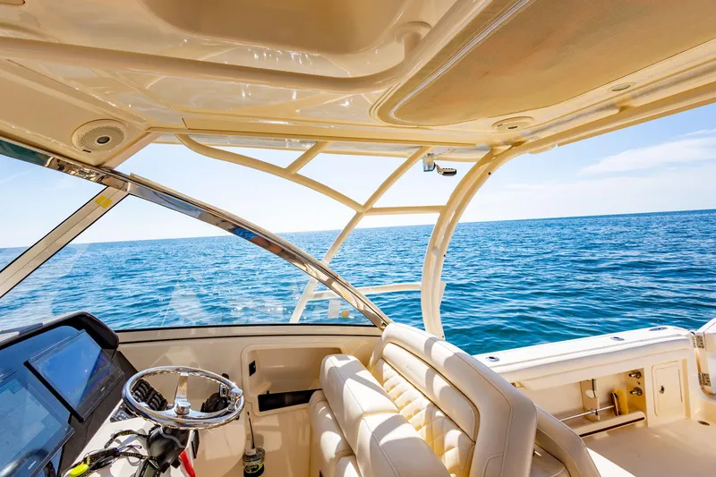 Slide: The Image of Interior view of 2018 Grady-White Freedom 335 boat on open water. - 12