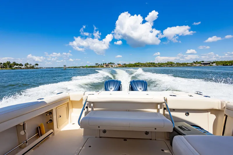 Slide: The Image of 2018 Grady-White Freedom 335 cruising on a sunny day with a scenic water view. - 3