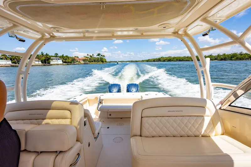 Slide: The Image of 2018 Grady-White Freedom 335 cruising on a sunny day, view from the cockpit. - 6