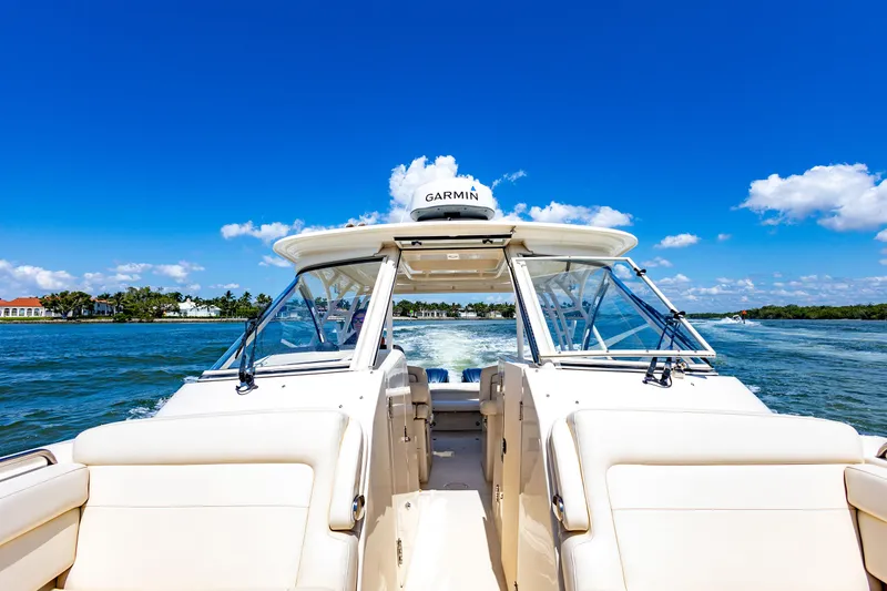 Slide: The Image of 2018 Grady-White Freedom 335 boat cruising on a sunny day. - 8