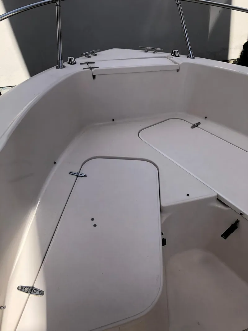 Slide: The Image of 1999 Grady-White 209 ESCAPE boat interior with storage compartments. - 12
