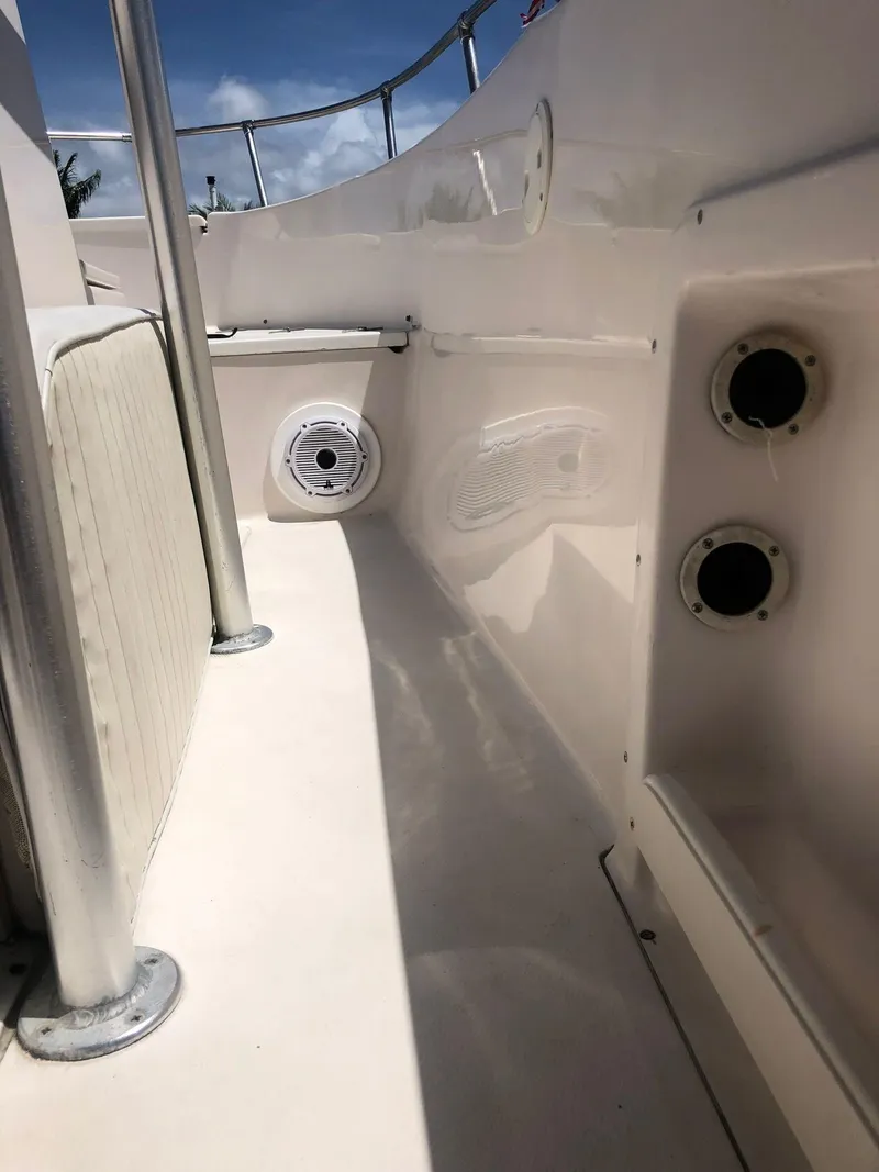 Slide: The Image of 1999 Grady-White 209 ESCAPE boat interior with speakers and rod holders. - 16