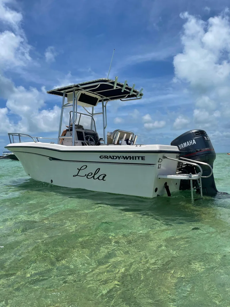 Slide: The Image of Grady-White 209 ESCAPE 1999 boat named Lela in clear shallow water with Yamaha motor. - 4