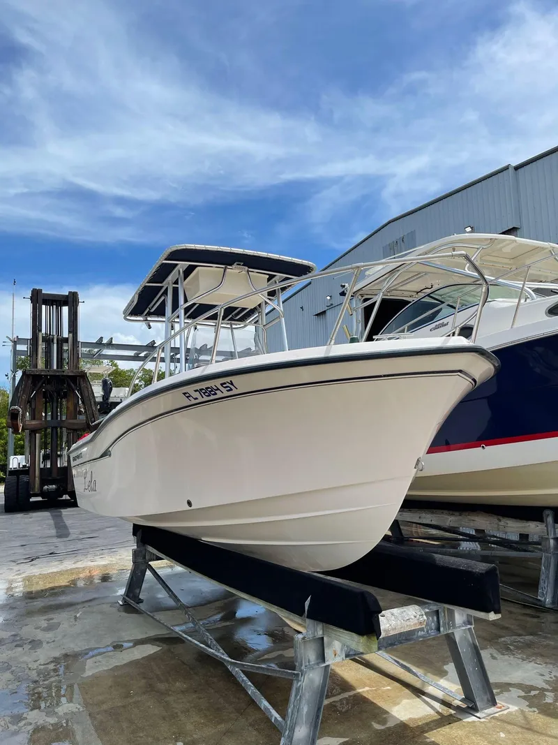 Slide: The Image of 1999 Grady-White 209 ESCAPE boat on a lift, ready for launch. - 5