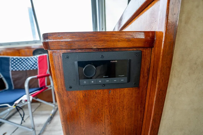 Slide: The Image of Fusion stereo system on 1984 Bertram 33 Sport Fisherman boat interior. - 16