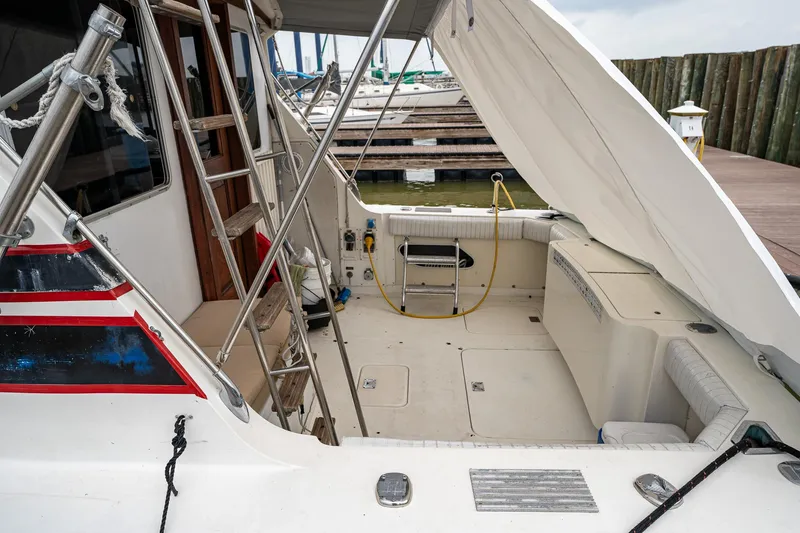 Slide: The Image of 1984 Bertram 33 Sport Fisherman boat interior with ladder and seating area. - 5
