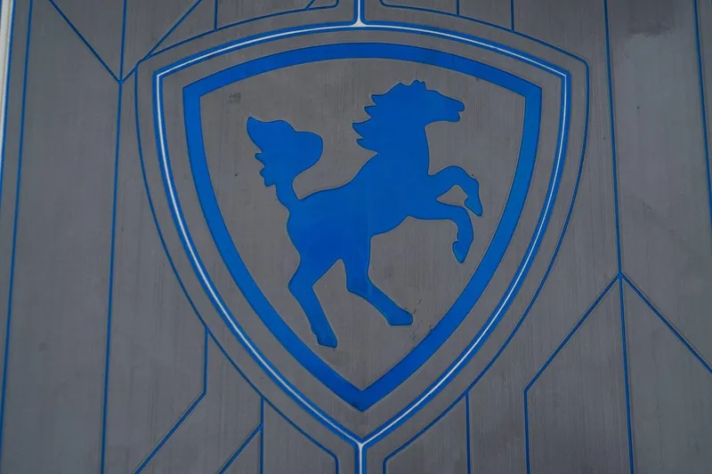 Slide: The Image of Blue horse emblem on Century 3200 Walk-Around boat, 2002 model. - 20